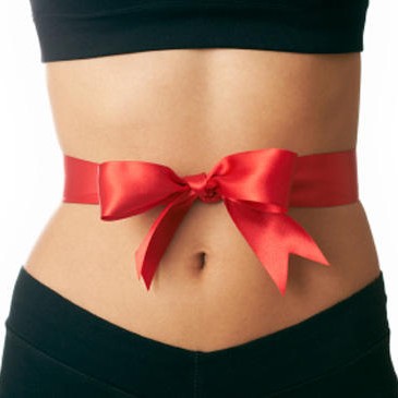 Photo: Red Ribbon and Bow tied around a Woman's Stomach