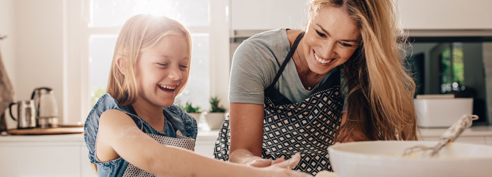 Photo: Mother and child cooking together