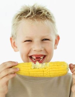 Photo: Boy Eating Corn on the Cob