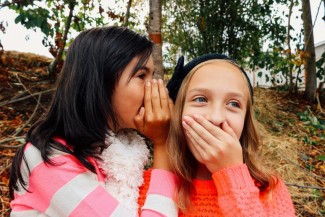Girls whispering Girls whispering