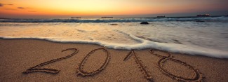 2018 written in the sand on a beach