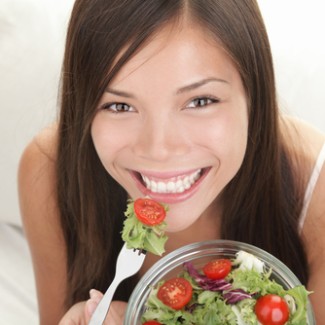 Photo: Woman Eating a Fresh Garden Salad