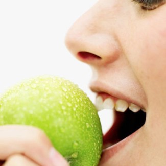 Photo: Woman Biting into an Apple