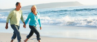 Photo: Older Couple Walking on the Beach