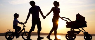 Photo: Family walking during sunset