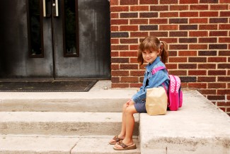 Healthy Back-to-school: In the lunch box! Photo: Girl Waiting Outside a School