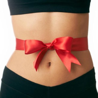Photo: Red Ribbon and Bow tied around a Woman's Stomach