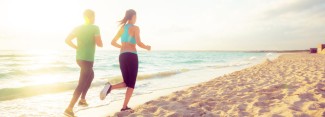 Photo: Couple Running on the Beach