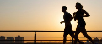 Photo: Silouette of Couple Running