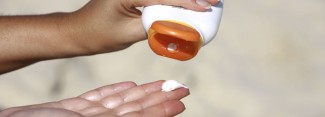 Photo: Person dispensing sunscreen