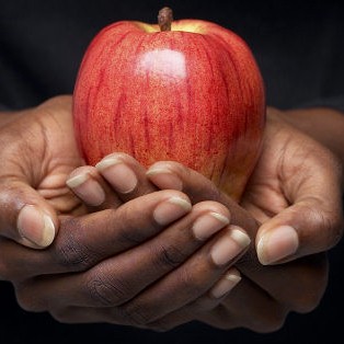 Photo: Hands Holding an Apple