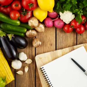 Photo: Fresh Fruits and Vegetables with a Notepad