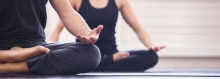 Photo: Young couple meditating together