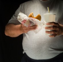 Photo: Overweight Man with a Burger and Soda