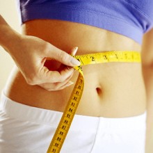 Photo: Woman Measuring Her Waist