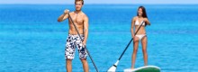 Photo: Man and Woman on Stand-Up Paddleboards