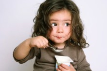 Photo: Girl Eating Yogurt