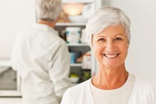 Photo: Older Woman Smiling in the Kitchen