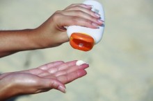 Photo: Person Using Sunscreen