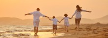 Photo: Family Walking on the Beach