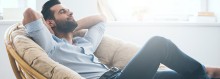 Photo: Man sitting down relaxing and in meditation